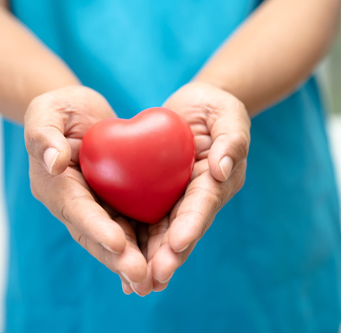 caregiver holding a tomato