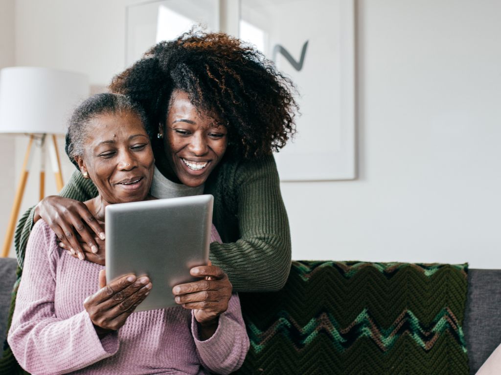 caregiver reading with elderly