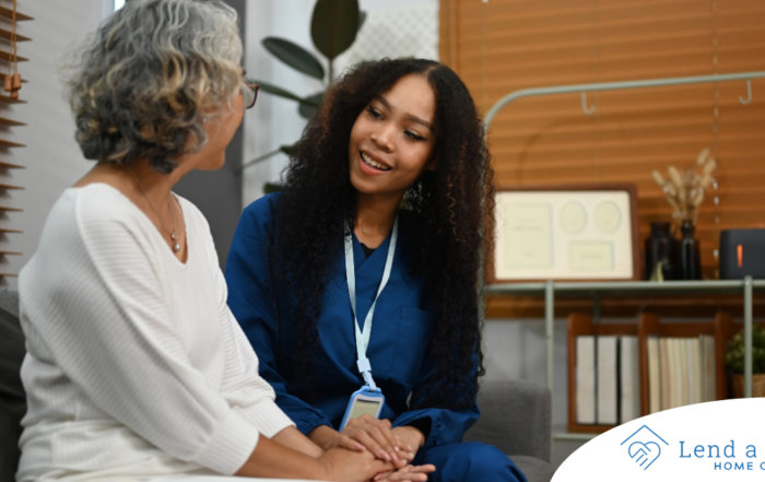 A caregiver patiently and kindly sits down and talks with a senior client, setting a good example for caregivers when it comes to communication.
