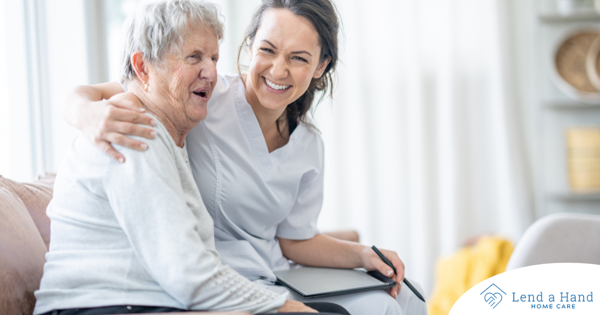 A professional caregiver embraces a senior client, showing the level of trust and comfort between them.