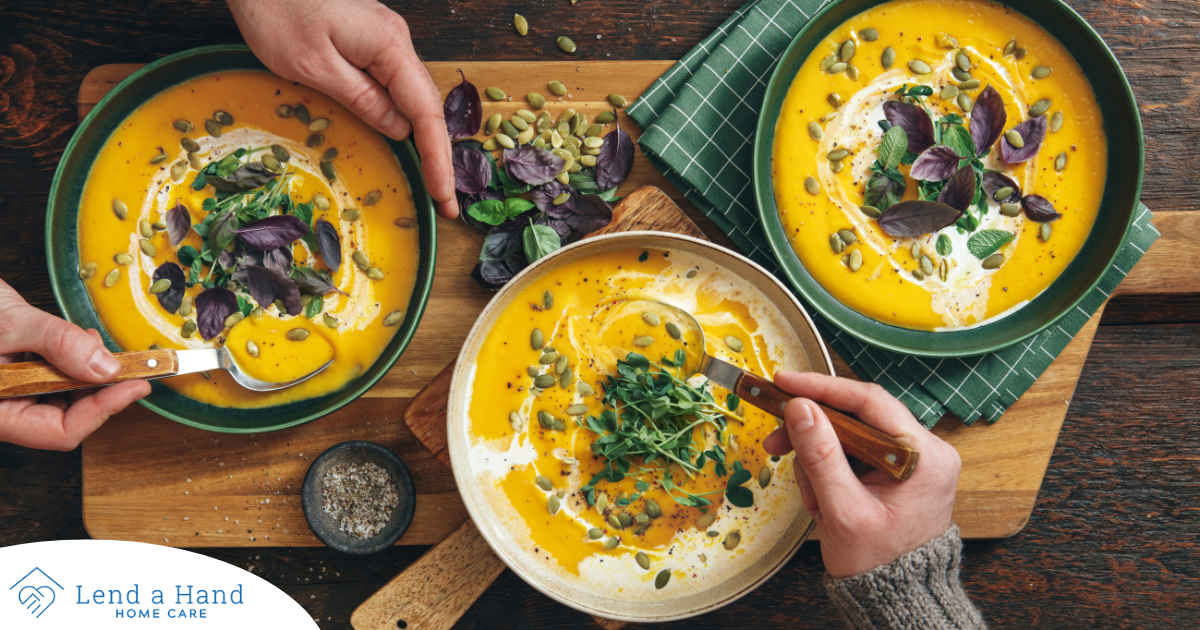 Pumpkin soup like the one in these bowls can be a great choice for a winter food for older adults.