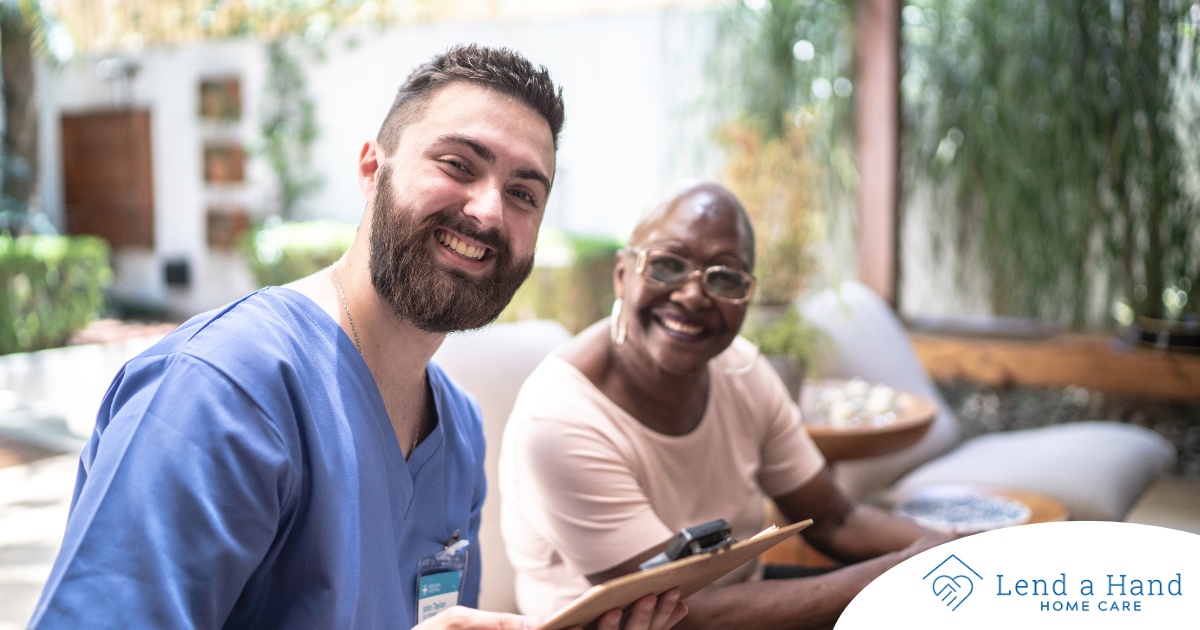 A caregiver and client smile showing that a career as a caregiver can be rewarding.
